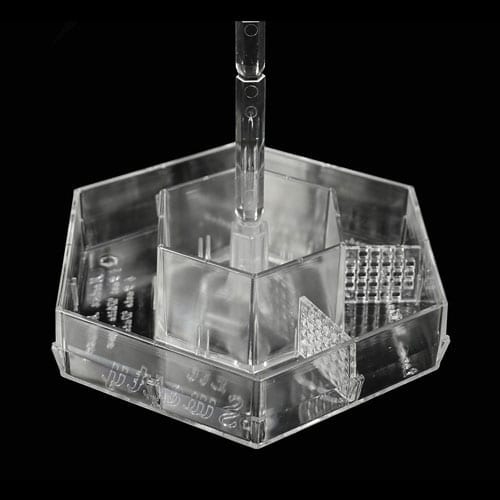 A clear plastic container with many compartments.