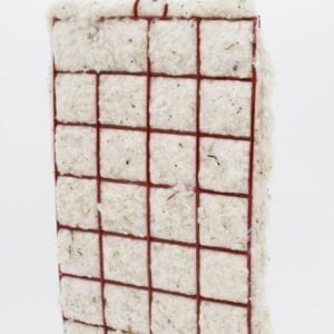 A piece of rice cake with red lines on it.