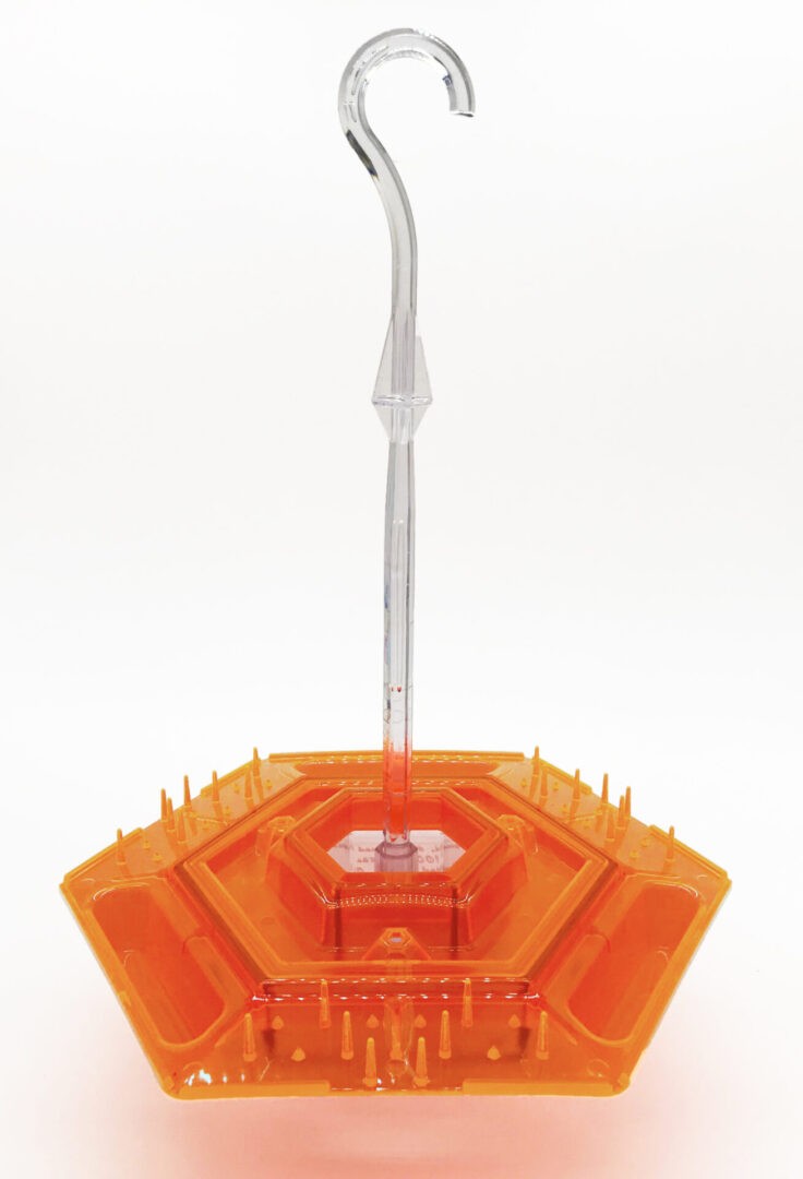 A close up of an orange umbrella